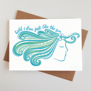 'Wild and Free' greetings card featuring an artwork of an ocean loving lady with flowing, sea-like hair, and the wording 'wild and free just like the sea'